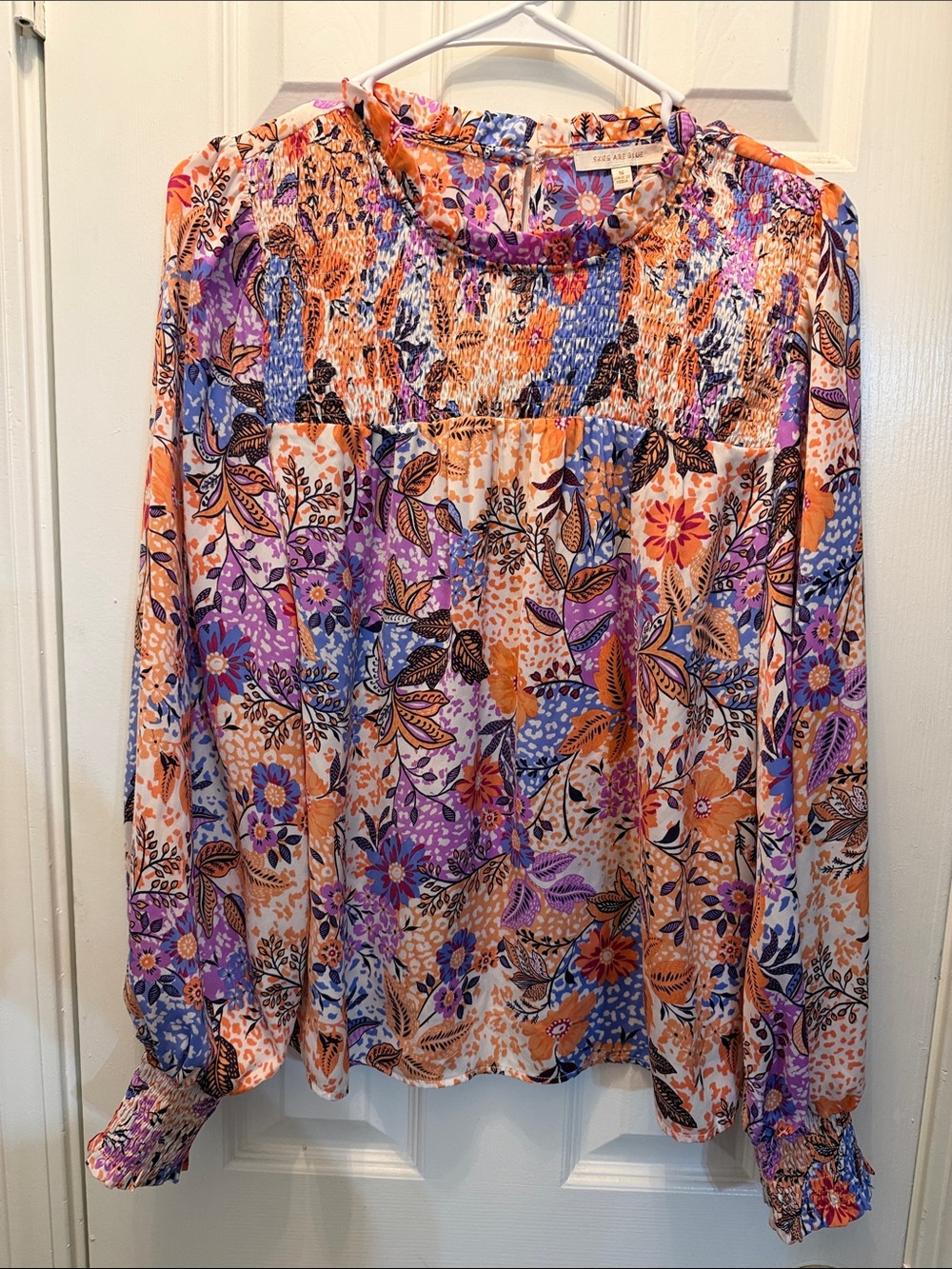Skies Are Blue Floral Smocked Blouse in Orange, Purple & Blue